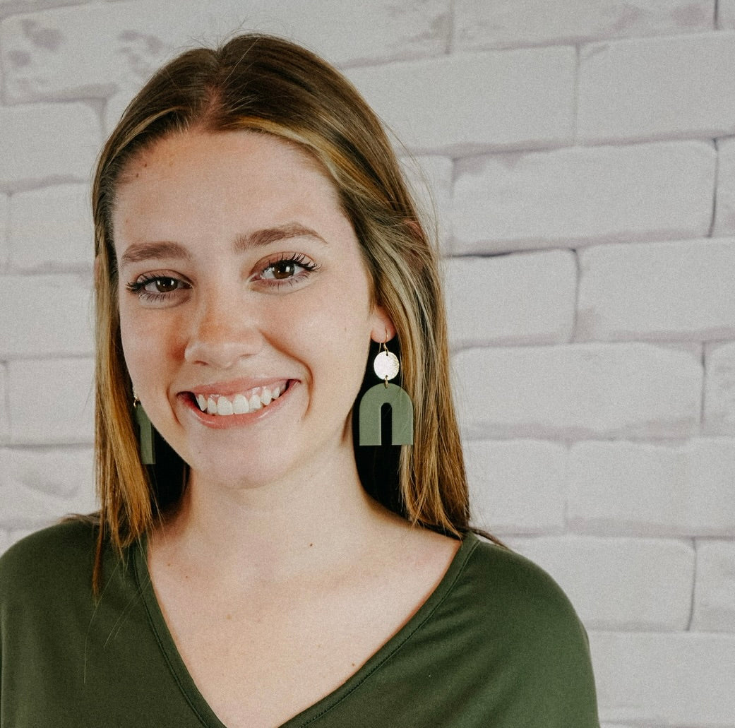 green arch earrings made of polymer clay with gold circle accents