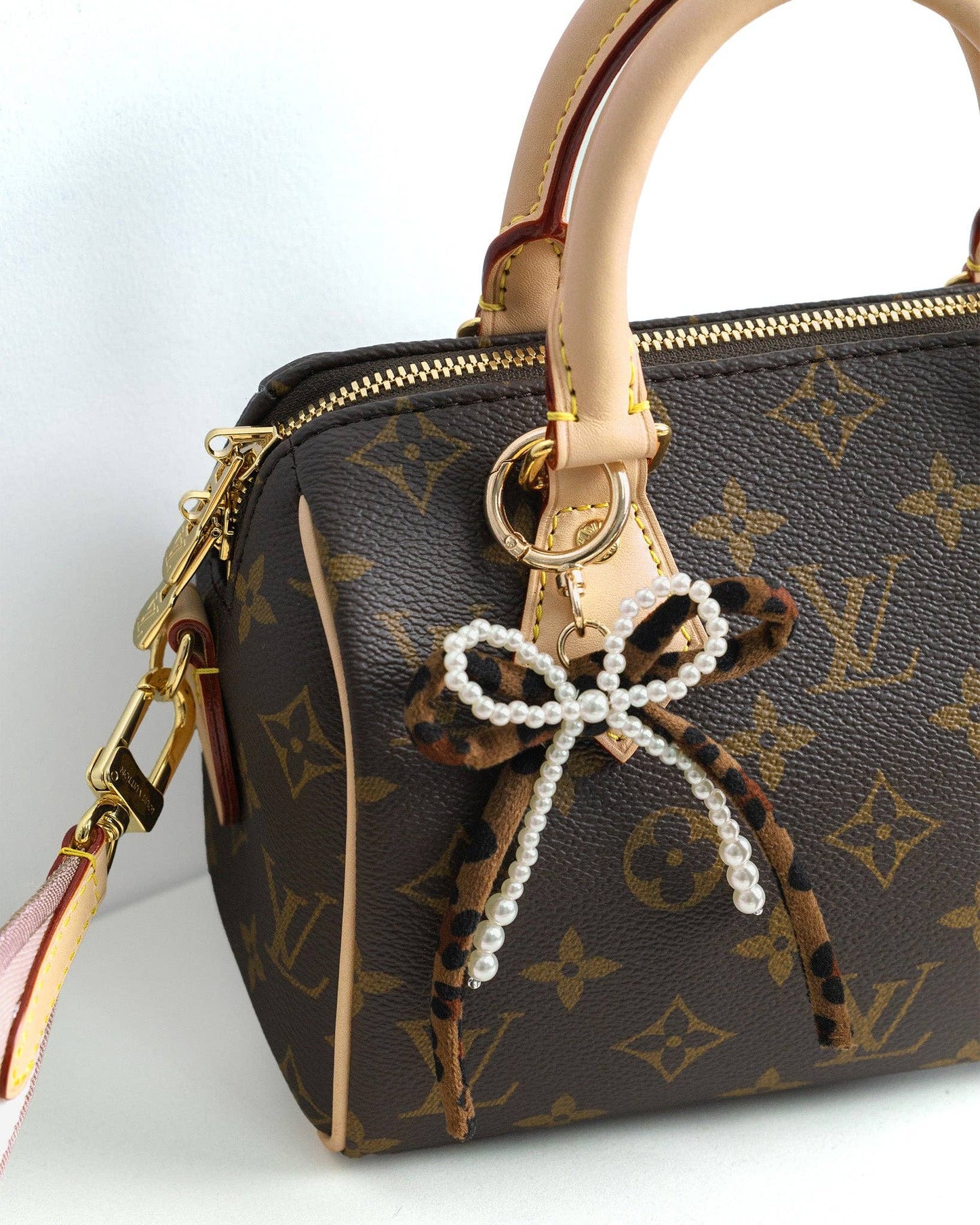 Lana Leopard Pearl Bow Bag Charm
