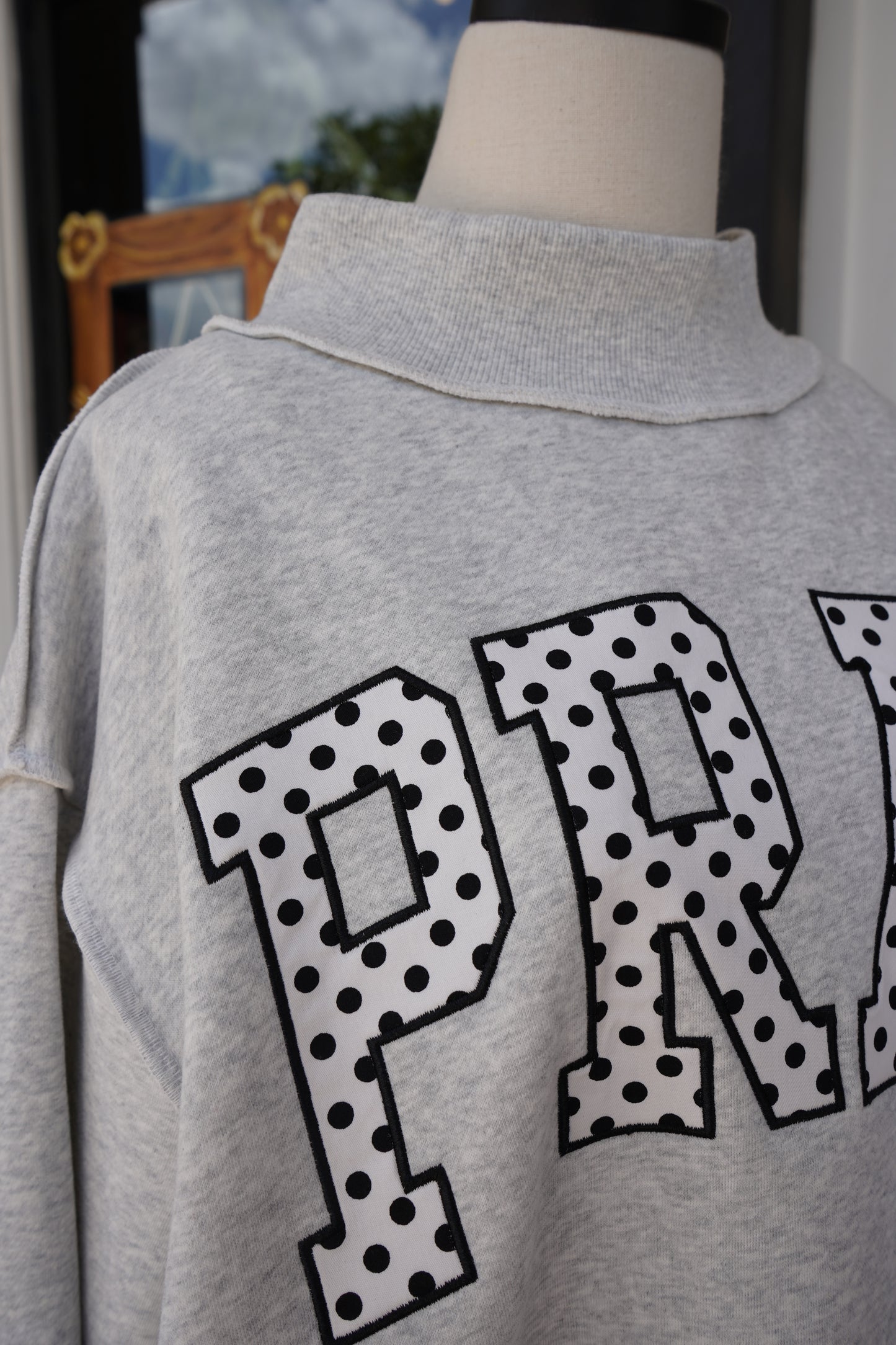 "PRAY" Polka Dot Mock Neck